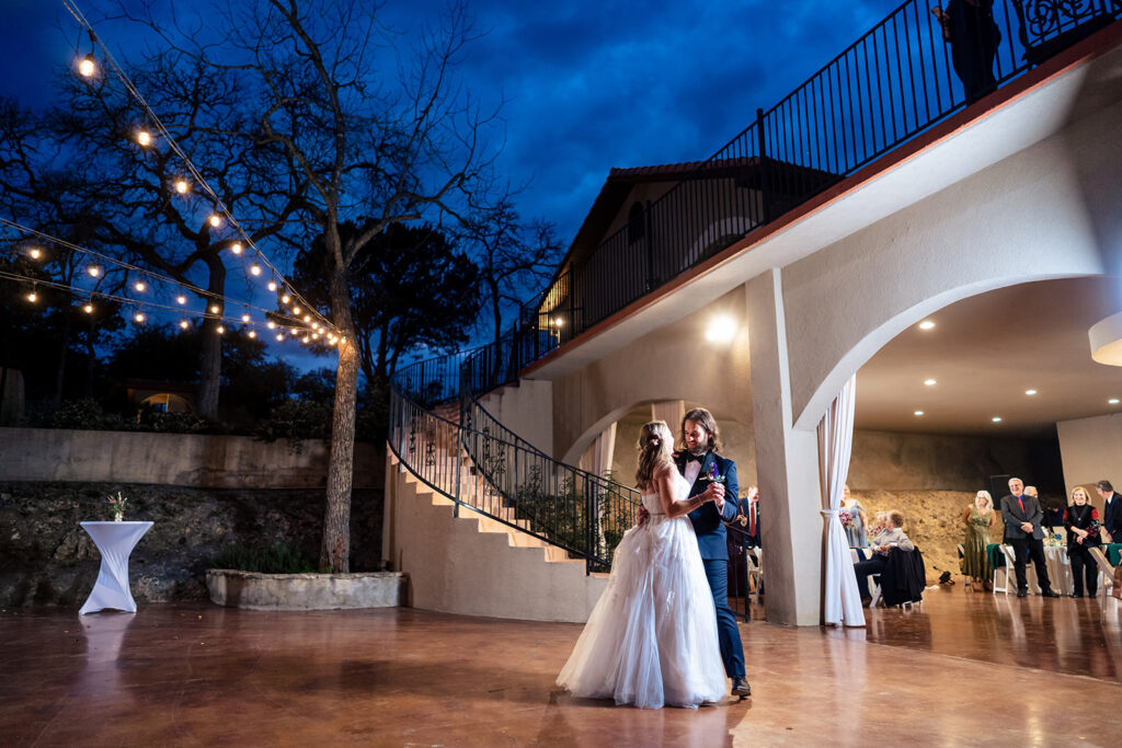 Couple during their first dance at the Messina Inn in Wimberley, Texas