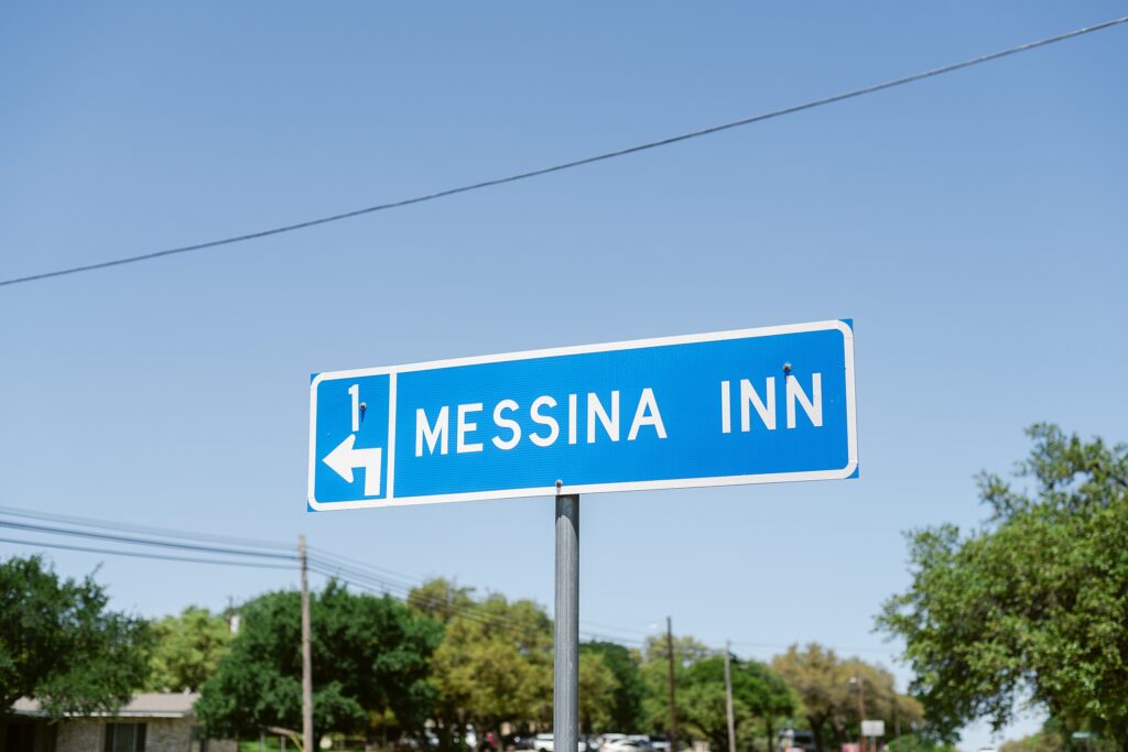 Road sign in Wimberley to Messina Inn
