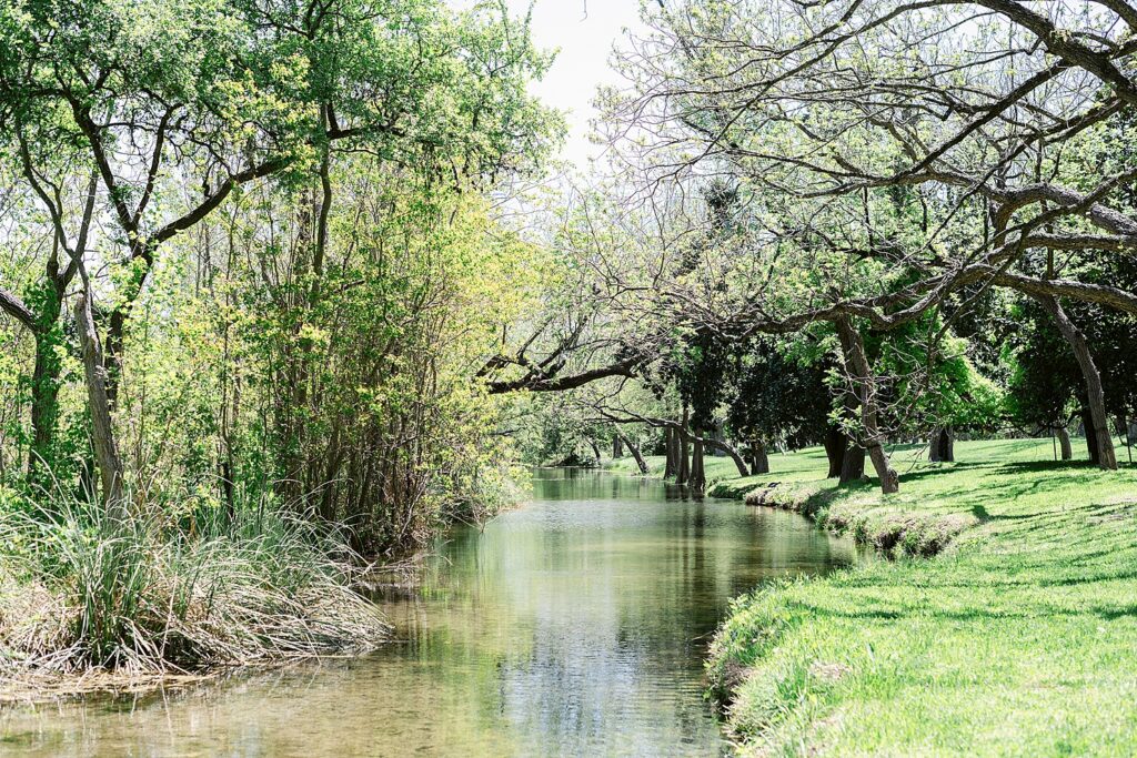 The Cypress creek next to the Messina Inn property in Wimberley, Texas